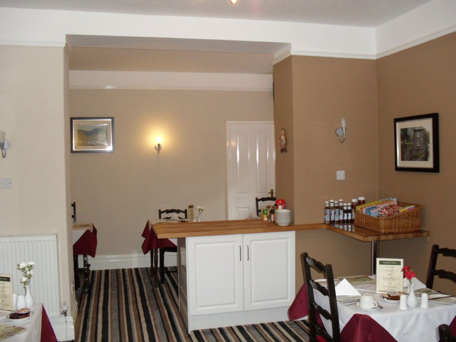 Breakfast servery with cereals, tea things and a menu stand